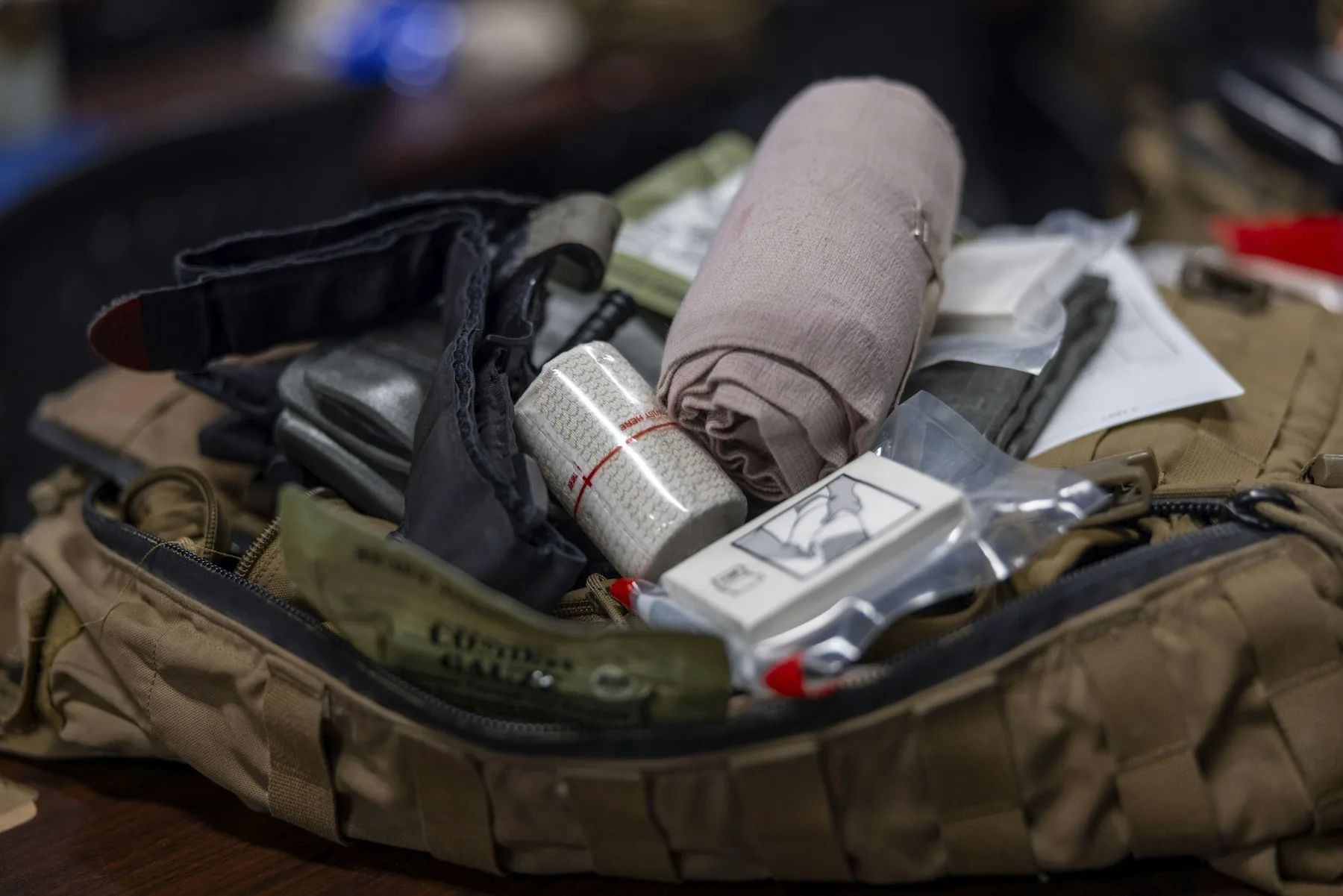 An open field first aid kit filled with bandages and medical supplies